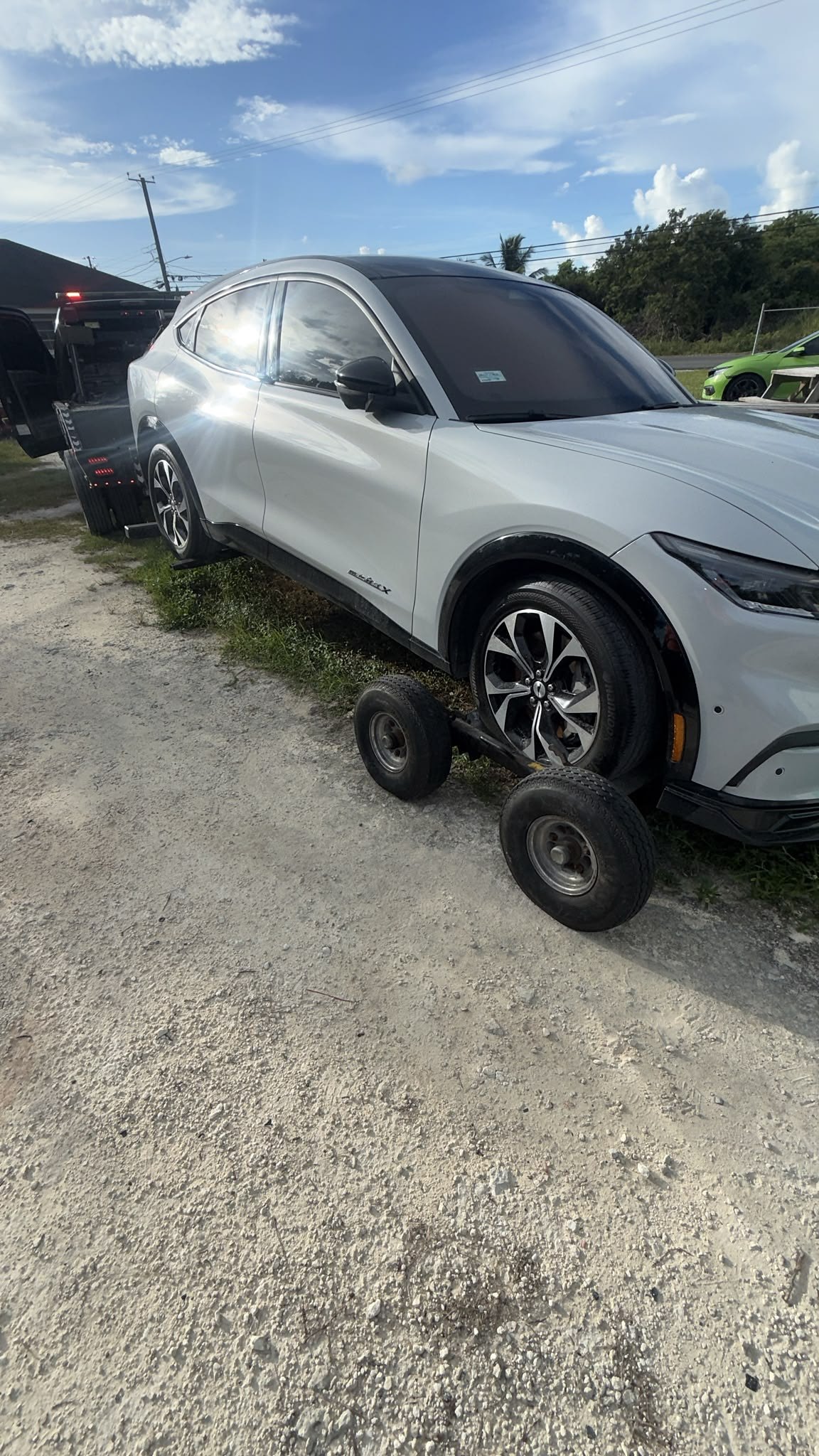 Electric SUV being moved on dollies to protect the drivetrain